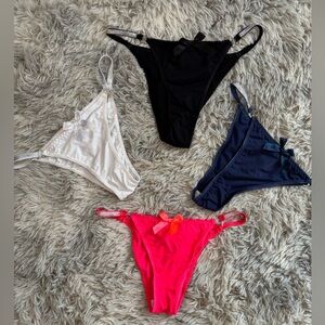 NWOT Set of Four Women's Detachable Thongs in Black, White, Blue, and Pink